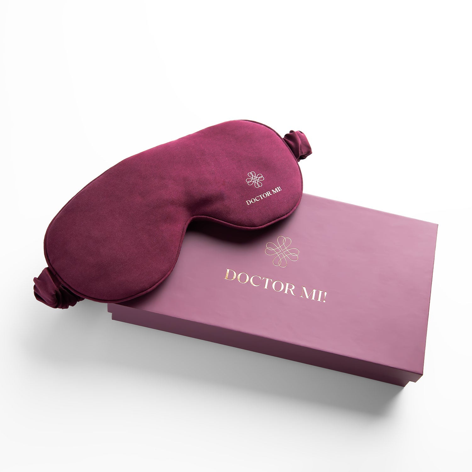 DOCTOR MI! SLEEP MASK hochwertige Schlafmaske für erholsame Nächte als praktischer Reisebegleiter in rotem Material mit roter Box auf grauem Hintergrund